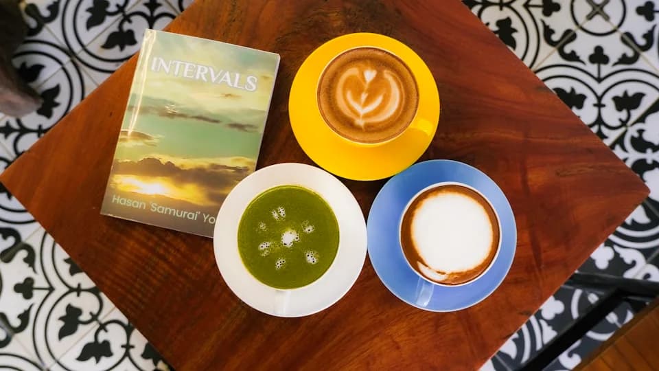 Coffee and a book on a table